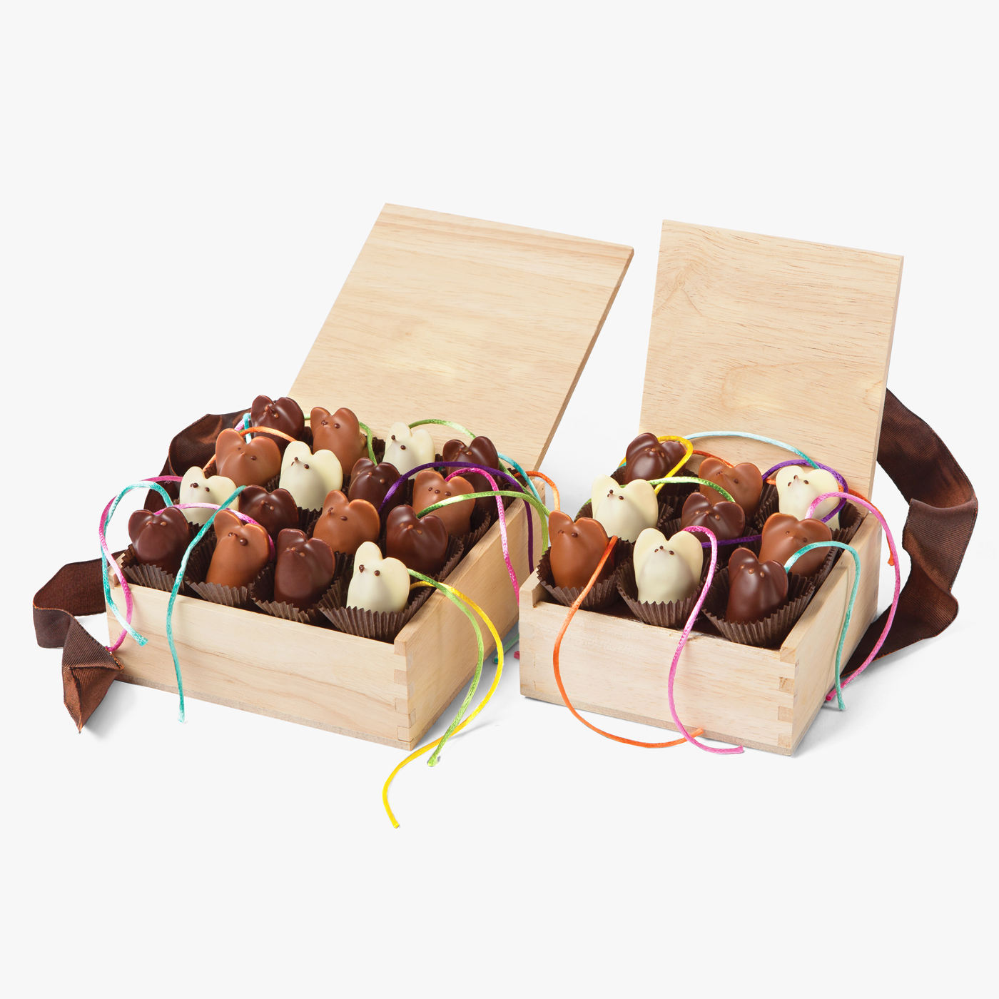 Our signature handmade chocolate mice in a beautiful wooden crate. Dark chocolate, white chocolate, and milk chocolate make the perfect gift.